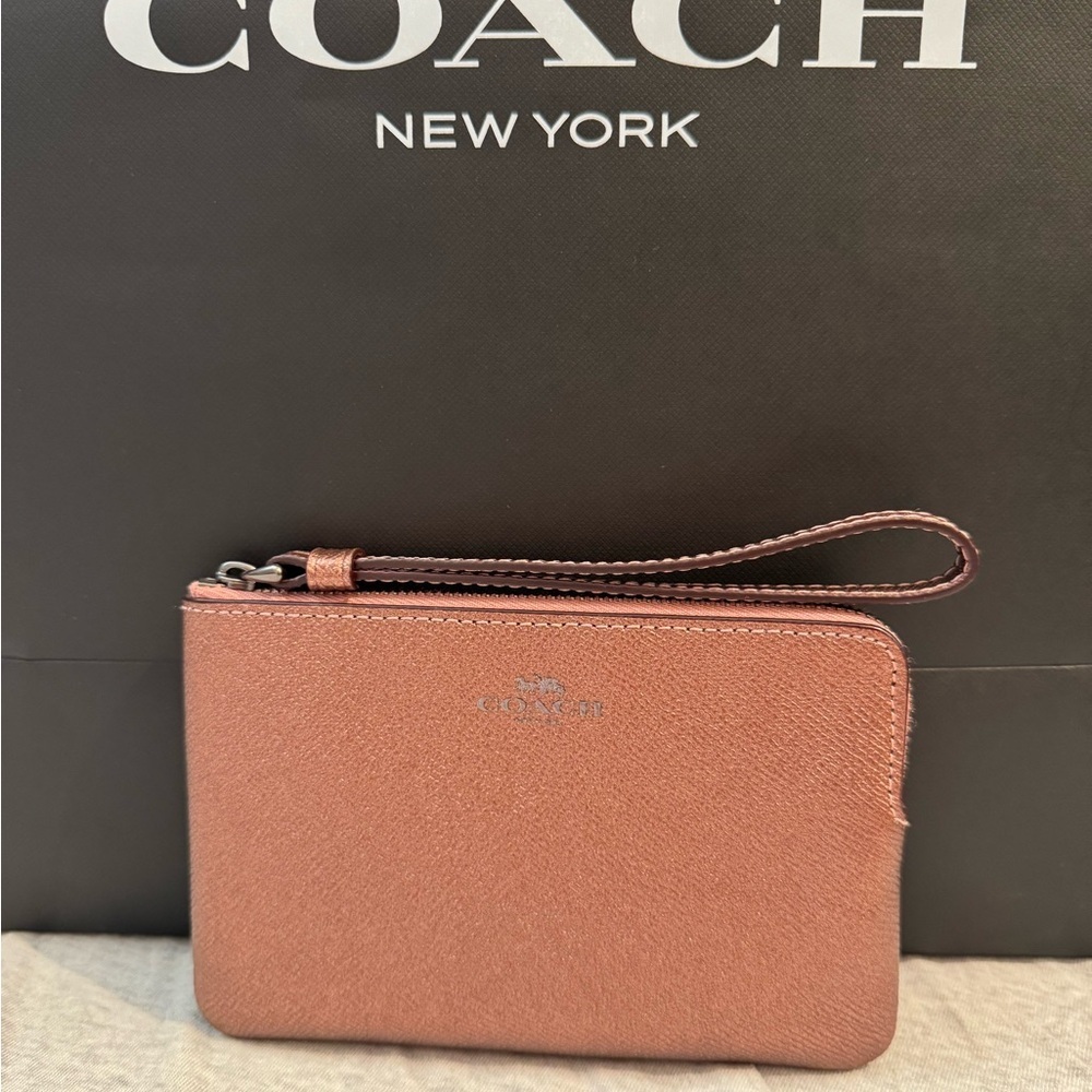 Coach pink metallic gently used minimal signs of ware refer to pictures.
